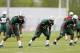 FLORHAM PARK, NJ - MAY 16: Safety Calvin Pryor #35 Linebacker Jeremiah George #53 and Linebacker Ike Enemkpali #51 of the New York Jets get set to run a special teams drill during the first day of rookie minicamp on May 16, 2014 in Florham Park, New Jersey. (Photo by Rich Schultz /Getty Images)