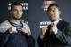 Dutch middleweight fighter Gegard Mousasi, left, and Mark Munoz from the US, right, pose for the photographers prior to a joint press conference in Berlin, Germany, Thursday, April 3, 2014. Munoz and Mousasi will fight during a UFC (Ultimate Fighting Championship) fight night in Berlin on Saturday, May 31, 2014. (AP Photo/Michael Sohn)