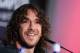 FC Barcelona's Carles Puyol smiles, during a press conference at the Nou Camp stadium in Barcelona, Spain, Thursday, May 15, 2014. Puyol reluctantly quit football on Thursday, his knees no longer able to endure the demands of the Barcelona defense after 15 years, the most successful period in the club's history. (AP Photo)