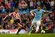 MANCHESTER, ENGLAND - APRIL 16: Lee Cattermole of Sunderland and Alvaro Negredo of Manchester City compete for the ball during the Barclays Premier League match between Manchester City and Sunderland at Etihad Stadium on April 16, 2014 in Manchester, England. (Photo by Michael Regan/Getty Images)