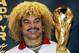 Colombia's soccer star Carlos Valderrama poses with the Fifa World Cup trophy in Bogota, Colombia, Monday, Jan.30, 2006. The trophy is on a tour through Latin America . (AP Photo/Fernando Vergara)