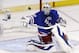 New York Rangers goalie Henrik Lundqvist makes a save during the first period of Game 4 of the NHL hockey Stanley Cup playoffs Eastern Conference finals against the Montreal Canadiens, Sunday, May 25, 2014, in New York. (AP Photo/Seth Wenig)