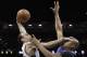 San Antonio Spurs' Manu Ginobili, left, shoots over Oklahoma City Thunder's Caron Butler (2) during the second half of Game 5 of the Western Conference finals NBA basketball playoff series, Thursday, May 29, 2014, in San Antonio. San Antonio won 117-89. (AP Photo/Eric Gay)