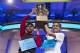 Ansun Sujoe, 13, of Fort Worth, Texas, left, and Sriram Hathwar, 14, of Painted Post, N.Y., raise the championship trophy after being named co-champions of the National Spelling Bee, on Thursday, May 29, 2014, in Oxon Hill, Md. (AP Photo/Evan Vucci)