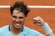 Spain's Rafael Nadal clenches his fist after defeating Austria's Dominic Thiem during the second round match of the French Open tennis tournament at the Roland Garros stadium, in Paris, France, Thursday, May 29, 2014. Nadal won 6-2, 6-2, 6-3. (AP Photo/Darko Vojinovic)