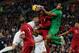England's Gary Cahill, second left, competes for the ball with Peru's Alexander Callens, center, and goalkeeper Raul Fernandez, second right, during the international friendly soccer match between England and Peru at Wembley Stadium in London, Friday, May 30, 2014. (AP Photo/Matt Dunham)
