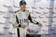Brad Keselowski poses with the pole award after he took the pole for Sunday's NASCAR Sprint Cup series auto race, Friday, May 30, 2014, at Dover International Speedway in Dover, Del. (AP Photo/Nick Wass)