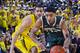 Michigan forward Jordan Morgan, left, defends Michigan State guard Gary Harris (14) in the first half of an NCAA college basketball game at Crisler Center in Ann Arbor, Mich., Sunday, Feb. 23, 2014. (AP Photo/Tony Ding)