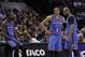 Oklahoma City Thunder's Kevin Durant (35), Russell Westbrook (0) and Caron Butler, right, wait to enter the game during the first half of Game 5 of the Western Conference finals NBA basketball playoff series against the San Antonio Spurs, Thursday, May 29, 2014, in San Antonio. (AP Photo/Eric Gay)