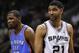May 29, 2014; San Antonio, TX, USA; Oklahoma City Thunder forward Kevin Durant (left) and San Antonio Spurs forward Tim Duncan (21) react during the second half in game five of the Western Conference Finals of the 2014 NBA Playoffs at AT&T Center. Mandatory Credit: Soobum Im-USA TODAY Sports