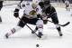 Chicago Blackhawks center Jonathan Toews, left, battles Los Angeles Kings center Anze Kopitar for the puck during first period of Game 6 of the Western Conference finals of the NHL hockey Stanley Cup playoffs in Los Angeles. Friday, May 30, 2014. (AP Photo/Chris Carlson)