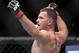 Stipe Miocic reacts after winning by knockout over Shane Del Rosario in the second round during a UFC 146 heavyweight bout on Saturday, May 26, 2012, in Las Vegas. (AP Photo/Julie Jacobson)