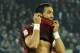 AS Roma's Mehdi Benatia bites his jersey after he scored a disallowed goal in offside during a Serie A soccer match between Napoli and Roma, at the San Paolo stadium in Naples, Italy, Sunday, March 9, 2014. (AP Photo/Salvatore Laporta)