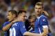 Bosnia-Herzegovina's Edin Dzeko, right, is congratulated by teammates Sejad Salihovic, left, Izet Hajrovic (20), and Edin Visca after scoring during the second half in an international friendly soccer match against Ivory Coast on Friday, May 30, 2014, in St. Louis. Dzeko score both Bosnian goals in the team's 2-1 victory. (AP Photo/Jeff Roberson)