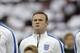 England's Wayne Rooney stands in a team line up during the playing of the national anthems before the international friendly soccer match between England and Peru at Wembley Stadium in London, Friday, May 30, 2014. (AP Photo/Matt Dunham)