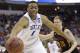 Duke forward Jabari Parker (1) works against Mercer forward Jakob Gollon (20) during the first half of an NCAA college basketball second-round game, Friday, March 21, 2014, in Raleigh, N.C. (AP Photo/Gerry Broome)