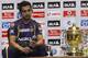 Kolkata Knight Riders captain Gautam Gambhir sits next to the winning trophy of the Indian Premier League (IPL) during a photo call on the eve of the final match against Chennai Super Kings, in Chennai, India, Saturday, May 26, 2012. (AP Photo/Aijaz Rahi)