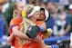 Florida pitcher Hannah Rogers, Taylor Schwarz, front, and Kelsey Stewart, right, celebrate after defeating Baylor during an NCAA women's softball College World Series tournament game, Sunday, June 1, 2014, in Oklahoma City. Florida won 6-3. (AP Photo/Alonzo Adams)
