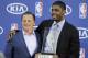 Cleveland Cavaliers' Kyrie Irving, right, poses with Cavaliers' owner Dan Gilbert after Irving was presented with the NBA Rookie of the Year award at the basketball team's headquarters in Independence, Ohio Tuesday, May 15, 2012. (AP Photo/Mark Duncan)