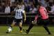 Argentina's Sergio Aguero, left, tries to shoot around Bosnia goalkeeper Asmir Begovic during the first half of an international friendly soccer match Monday, Nov. 18, 2013, in St. Louis. (AP Photo/Jeff Roberson)