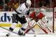 Los Angeles Kings right wing Justin Williams (14) attempts to shoot against Chicago Blackhawks goalie Corey Crawford (50) during the first period in Game 7 of the Western Conference finals in the NHL hockey Stanley Cup playoffs Sunday, June 1, 2014, in Chicago. (AP Photo/Nam Y. Huh)