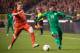 Belgium's Kevin De Bruyne, left, challenges Ivory Coast's Serge Aurier during a friendly soccer match at the King Baudouin stadium in Brussels on Wednesday March 5, 2014. (AP Photo/Geert Vanden Wijngaert)