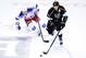 LAS VEGAS, NV - SEPTEMBER 27: Drew Doughty #8 of the Los Angeles Kings brings the puck up the ice as Jesper Fast #31 of the New York Rangers defends during a preseason game at the MGM Grand Garden Arena on September 27, 2013 in Las Vegas, Nevada. Los Angeles won 4-1. (Photo by Ethan Miller/Getty Images)