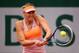 PARIS, FRANCE - JUNE 01: Maria Sharapova of Russia plays a backhand in her women's singles match against Samantha Stosur of Australia on day eight of the French Open at Roland Garros on June 1, 2014 in Paris, France. (Photo by Clive Brunskill/Getty Images)