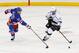 Nov 17, 2013; New York, NY, USA; Los Angeles Kings center Anze Kopitar (11) keeps the puck from New York Rangers defenseman Ryan McDonagh (27) during the third period at Madison Square Garden. Kings won 1-0. Mandatory Credit: Anthony Gruppuso-USA TODAY Sports