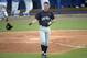 Long Beach State's Michael Hill tosses his helmet after striking out to end the third inning of an NCAA college baseball regional tournament game against North Carolina in Gainesville, Fla., Sunday, June 1, 2014.(AP Photo/Phelan M. Ebenhack)