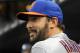 New York Mets starting pitcher Matt Harvey smiles as he talks with trainer Ray Ramirez before the interleague baseball game against the New York Yankees at Yankee Stadium on Monday, May 12, 2014, in New York. Harvey is recovering from Tommy John surgery. (AP Photo/Kathy Kmonicek)
