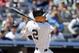 New York Yankees' Derek Jeter follows through on an RBI-single during the fourth inning of a baseball game against the Minnesota Twins, Sunday, June 1, 2014, in New York. (AP Photo/Jason DeCrow)