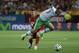 Spain's Alberto Moreno, rear, and Bolivia's Gualberto Mojica, vie for the ball during their friendly soccer match in Seville, on Friday, May 30. 2014. (AP Photo/Miguel Angel Morenatti)