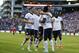 USA's Eddie Johnson (18), second from right, is hugged by USA's Brad Evans, upper right, after Johnson scored a goal against Panama in the second half of a World Cup qualifier soccer match, Tuesday, June 11, 2013, in Seattle. Looking on at left is Geoff Cameron (20) and Clint Dempsey, second from left, and at right is Jozy Altidore (17). USA defeated Panama, 2-0. (AP Photo/Ted S. Warren)