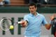 Serbia's Novak Djokovic returns the ball to France's Jo-Wilfried Tsonga during their fourth round match of the French Open tennis tournament at the Roland Garros stadium, in Paris, France, Sunday, June 1, 2014. Djokovic won 6-1, 6-4, 6-1. (AP Photo/David Vincent)