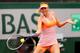 PARIS, FRANCE - JUNE 03: Maria Sharapova of Russia returns a shot during her women's singles quarter-final match against Garbine Muguruza of Spain on day ten of the French Open at Roland Garros on June 3, 2014 in Paris, France. (Photo by Clive Brunskill/Getty Images)