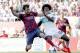 Barcelona's Cesc Fabregas, left, duels the ball with Carlos Alberto Sanchez Moreno during a Spanish La Liga soccer match at the Martinez Valero stadium in Elche, Spain, on Sunday, May 11, 2014. (AP Photo/Alberto Saiz)
