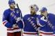 New York Rangers goalie Henrik Lundqvist, center, reacts to the crowd as teammates Dan Girardi (5) and goalie Cam Talbot (33) skate alongside him after the Rangers beat the Montreal Canadiens 1-0 in Game 6 of the NHL hockey Stanley Cup playoffs Eastern Conference finals, Thursday, May 29, 2014, in New York. The Rangers advance to the Stanley Cup Final. (AP Photo/Frank Franklin II)