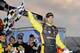 Driver Matt Crafton celebrates in victory lane after winning a NASCAR Truck Series auto race at Martinsville Speedway in Martinsville, Va., Sunday, March 30, 2014. (AP Photo/Mike McCarn)