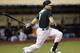 OAKLAND, CA - MAY 13: Craig Gentry #3 of the Oakland Athletics hits an RBI single scoring Josh Reddick #16 against the Chicago White Sox in the bottom of the fourth inning at O.co Coliseum on May 13, 2014 in Oakland, California. (Photo by Thearon W. Henderson/Getty Images)