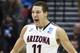 Arizona forward Aaron Gordon (11) beats his chest after scoring a basket against Gonzaga during the first half of a third-round game in the NCAA college basketball tournament Sunday, March 23, 2014, in San Diego. (AP Photo/Denis Poroy)