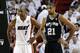 Miami Heat center Chris Bosh (1) and San Antonio Spurs forward Tim Duncan (21) stand on the court during the first half of Game 6 in their NBA Finals basketball series, Tuesday, June 18, 2013 in Miami. (AP Photo/Lynne Sladky)