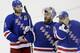 New York Rangers goalie Henrik Lundqvist, center, reacts to the crowd as teammates Dan Girardi (5) and goalie Cam Talbot (33) skate alongside him after the Rangers beat the Montreal Canadiens 1-0 in Game 6 of the NHL hockey Stanley Cup playoffs Eastern Conference finals, Thursday, May 29, 2014, in New York. The Rangers advance to the Stanley Cup Final. (AP Photo/Frank Franklin II)
