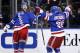 New York Rangers center Derick Brassard celebrates with right wing Mats Zuccarello (36) after scoring against the Montreal Canadiens during the second period of Game 4 of the NHL hockey Stanley Cup playoffs Eastern Conference finals, Sunday, May 25, 2014, in New York. (AP Photo/Kathy Willens)