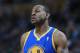 Golden State Warriors forward Andre Iguodala looks on against the Denver Nuggets in the fourth quarter of the Warriors' 89-81 victory in an NBA basketball game in Denver on Monday, Dec. 23, 2013. (AP Photo/David Zalubowski)