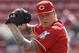 Cincinnati Reds starting pitcher Mat Latos throws against the New York Mets in the first inning of a baseball game, Wednesday, Sept. 25, 2013, in Cincinnati. (AP Photo/Al Behrman)