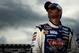 LONG POND, PA - AUGUST 02: Jimmie Johnson, driver of the #48 Lowe's Planes Chevrolet, stands on the grid after qualifying on the pole for the NASCAR Sprint Cup Series GoBowling.com 400 at Pocono Raceway on August 2, 2013 in Long Pond, Pennsylvania. (Photo by Jared C. Tilton/Getty Images)