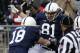 Penn State tight end Adam Breneman (81) celebrates after taking a pass from Penn State quarterback Christian Hackenberg (14) in the end zone for a touchdown, with teammate Jesse James (18), during an NCAA college football game against Nebraska in State College, Pa., Saturday, Nov. 23, 2013. (AP Photo/Gene J. Puskar)