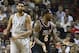 After fouling San Antonio Spurs' Tim Duncan (21), Miami Heat's LeBron James (6) reacts as he is charged with a technical foul also, during the second half of an NBA basketball game in Miami, Sunday, Jan. 26, 2014. The Heat won 113-101. (AP Photo/J Pat Carter)