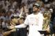 The Miami Heat's LeBron James holds the the Larry O'Brien NBA Championship Trophy after Game 7 of the NBA basketball championship against the San Antonio Spurs, Friday, June 21, 2013, in Miami. The Miami Heat defeated the San Antonio Spurs 95-88 to win their second straight NBA championship. (AP Photo/Lynne Sladky)